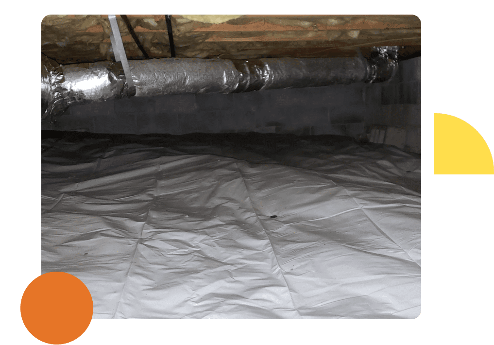 A picture of the inside of an attic with insulation.